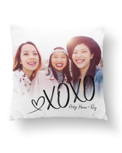 White fabric Friendship XOXO pillow with a photo of three smiling friends and handwritten signature style text in black.